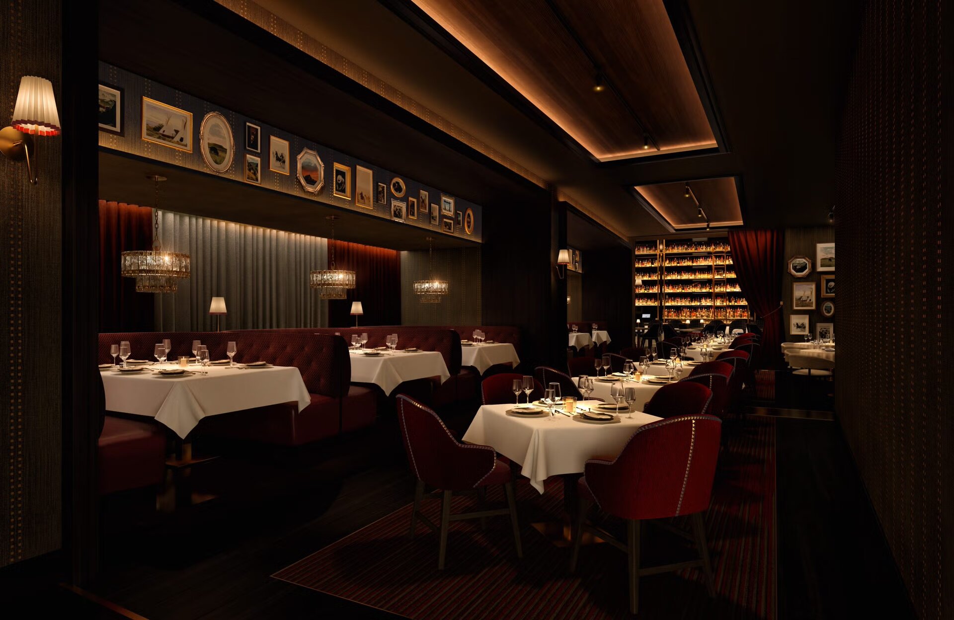 Dean's Lounge at JW Marriott Indianapolis — picture-frame paneled walls, banquette seating, hanging chandeliers, and curated bottle wall